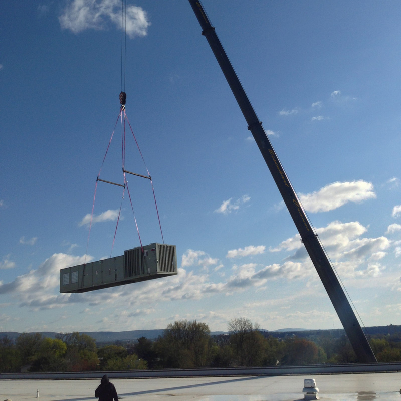 Crane Setting New Commercial Air Conditioning Unit
